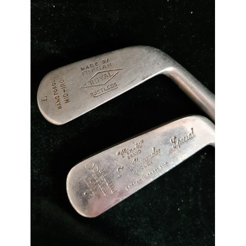 182 - Two vintage hand forged golf clubs. Including a Tom Alexander putter (6) with a Forgan Royal mid iro... 