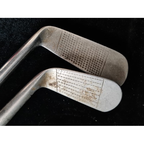 182 - Two vintage hand forged golf clubs. Including a Tom Alexander putter (6) with a Forgan Royal mid iro... 