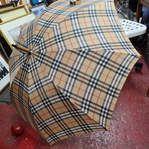 236 - A fabulous original Burberry umbrella featuring the classic nova check pattern in beige, navy blue a... 