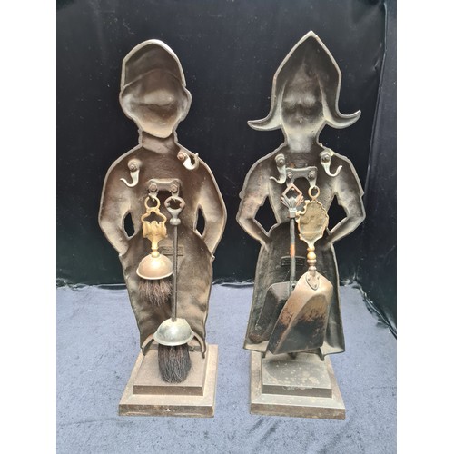 325 - Star Lot : An unusual pair of antique heavy, brass Dutch companion stands. Consisting of a male and ... 