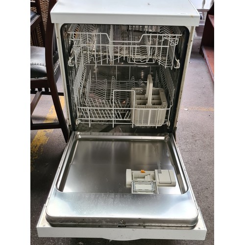 452 - Star Lot : A Miele G4100 freestanding dishwasher, with two levels and a utensil basket. In a white f... 