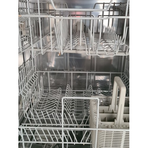 452 - Star Lot : A Miele G4100 freestanding dishwasher, with two levels and a utensil basket. In a white f... 