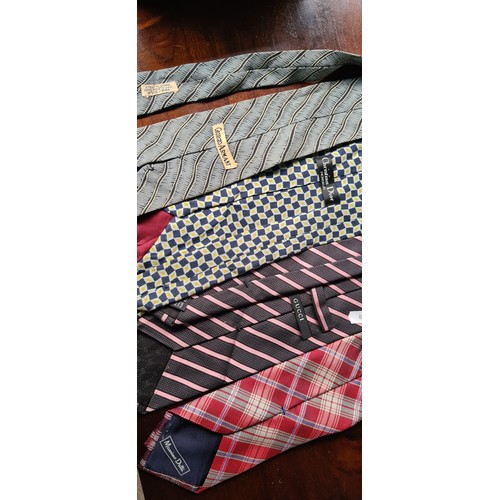 456 - A selection of seventeen ties, including examples from Gucci, Christian Dior and Reiss. In various s... 