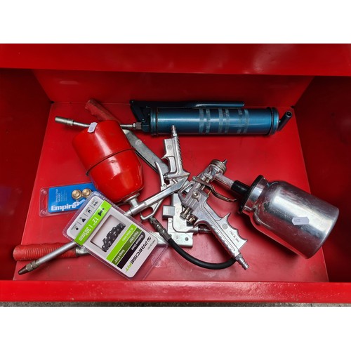 464 - A super seven-drawer metal rolling tool chest in castors, with contents including spray guns and foi... 