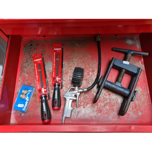 464 - A super seven-drawer metal rolling tool chest in castors, with contents including spray guns and foi... 