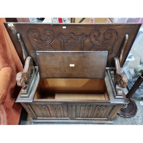 846 - A fantastic Arts and Crafts ecclesiastic style side flip top monks bench, whose top lift to form a b... 