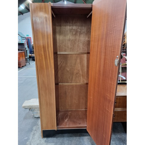 765 - A beautiful example of a Mid Century Modern wardrobe. A very well-maintained example designed with h... 