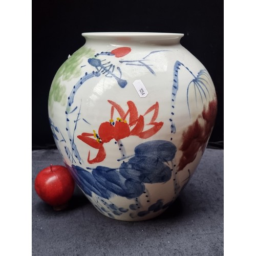 698 - A ver large heavy Chinese ceramic vase with hand painted abstract floral motifs in red, blue and gre... 