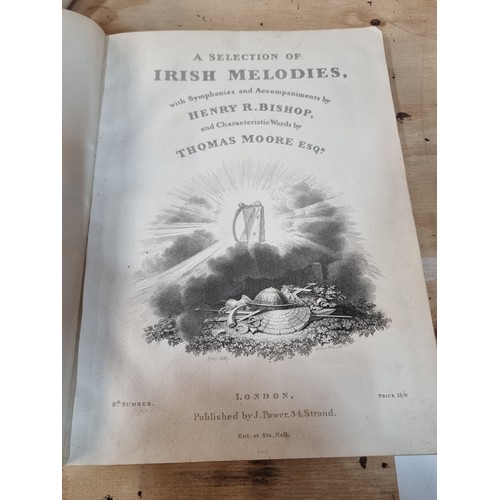 136 - Star Lot : An antique, first edition hardback book entitled 'Irish Melodies' by Thomas Moore, dated ... 