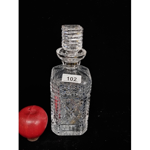 102 - A stunning large Waterford Crystal decanter with original stopper. A heavily cut piece with a strawb... 