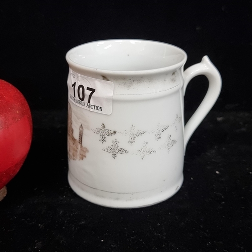 107 - An 1851 porcelain mug, featuring an illustration of the Crystal Palace, Great Exhibition  The mug is... 