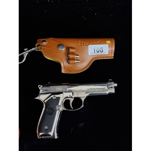 108 - A pistol lighter/torch by R Beretta resembling the real Italian 92F Army pistol. In a leather holste... 