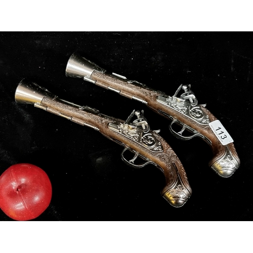 113 - Two Gonher Gonzalez display flintlock pistols. Spanish made pieces, with lots of wonderful and profu... 