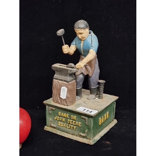 114 - A wonderful heavy John Deere cast metal money box, with slogan reading 