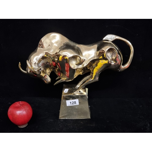 128 - Star Lot : A striking large polished heavy brass sculpture depicting a raging bull on a plinth. Grea... 