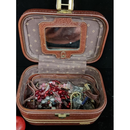 129 - A Samsonite jewellery case with a selection of jewellery, watches, pens  comprising of various neckl... 