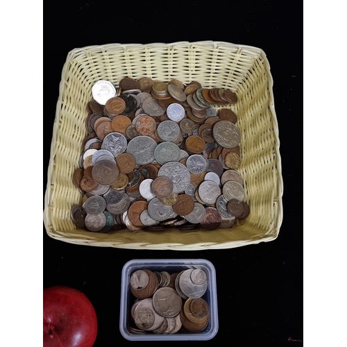 131 - A large selection  Irish and English coins, including vintage examples unchecked. A blue box and a w... 