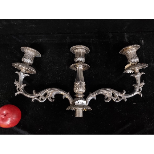 139 - An antique large  three-branch candelabra top with a very richly decorated drip pans and knops. H24c... 