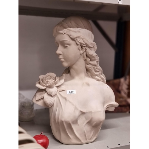 147 - A large laster bust of an elegant young lady in profile, with flowing hair  and a blooming rose on t... 