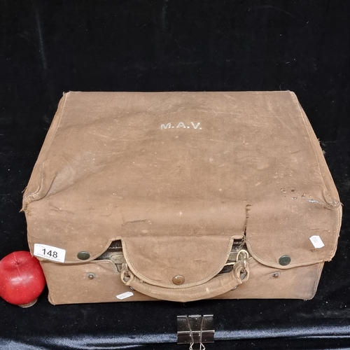 148 - Star lot : An exquisite early 20th century travel vanity case. Crafted from leather, with a heavy wo... 