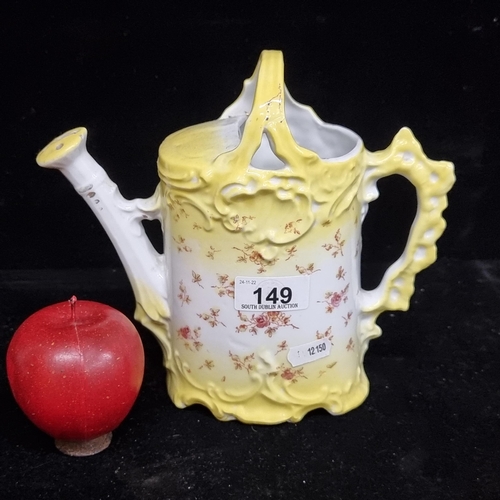 149 - A charming Victorian porcelain watering can with a lemon yellow graduating glaze and rose motifs. In... 