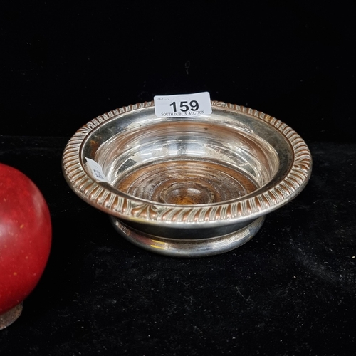 159 - A lovely large example of a late 19th century  Champagne  coaster, silver plated with turned oak bas... 