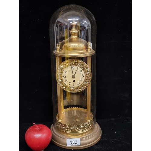 182 - Star lot : A large antique German very elegant, brass toned dome clock. Complete with glass dome, in... 