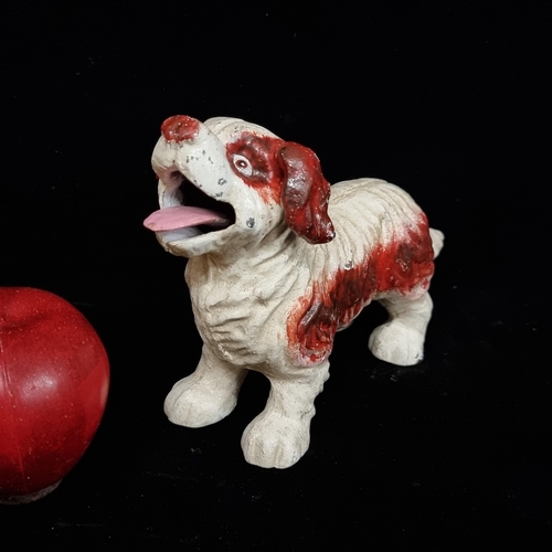 191 - A cast metal articulated dog figure with wagging tail and lapping tongue. Hand painted.