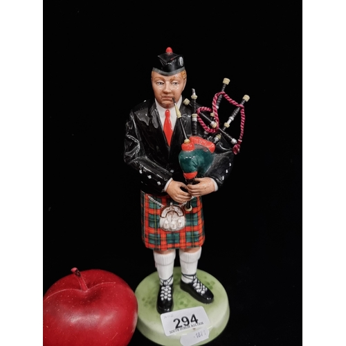 294 - A Royal Doulton figurine titled 'The Piper', H23cm. Small repair.