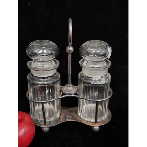 300 - A Large double jar silver plated holder made by Elkington, along with two glass lidded jars, all I n... 