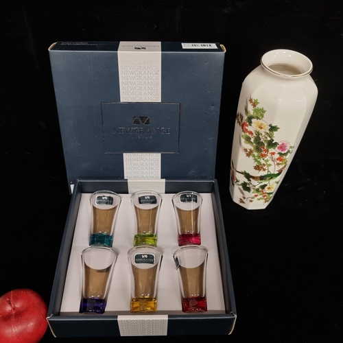 303 - Six Newgrange Living coloured glass shot glasses in original box, along with a tall Japanese flower ... 