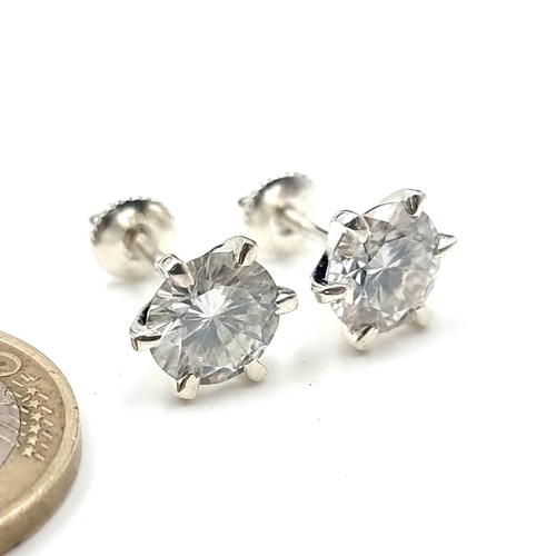 37 - A brilliant pair of 5 carat White Mossianite stud earrings, of fine cut and featuring screw sterling... 