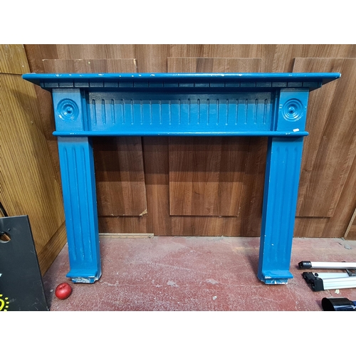 392 - A large wooden, mantle piece surround. With fluted detail and concentric circles. In a teal finish. ... 