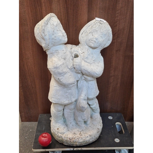 400 - A vintage, reconstituted stone garden statue of two embracing children. H70cm