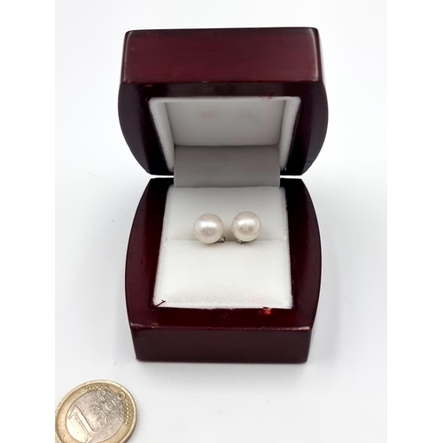 44 - A new very pretty pair of Pearl stud earrings by Heirloom Pearls. With sterling silver settings and ... 