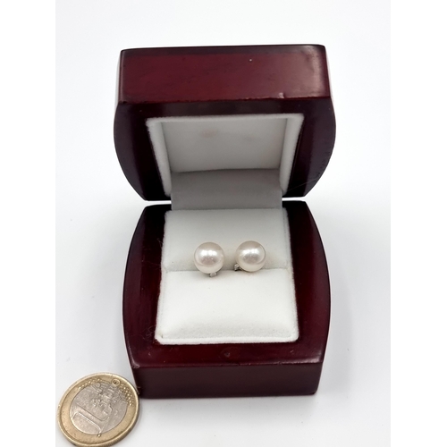 45 - A new very pretty pair of Pearl stud earrings by Heirloom Pearls. With sterling silver settings and ... 