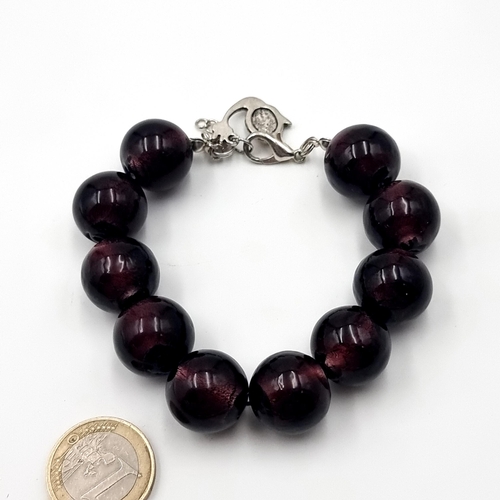48 - A good quality Chlobo design ten stone polished Amethyst bracelet. Set with a sterling silver lobste... 