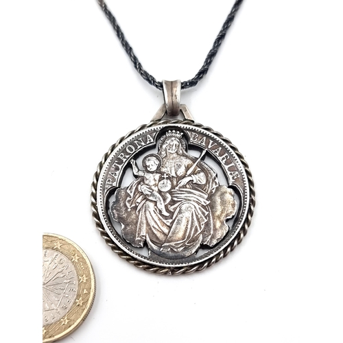 52 - A silver Madonna and child pendant, with a high quality sterling silver twist chain. Length of chain... 