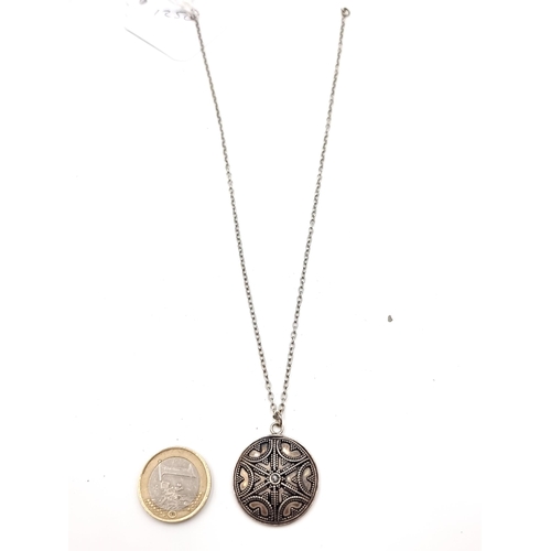 59 - An attractive intricate Shield design sterling silver pendant necklace, featuring a pretty abstract ... 