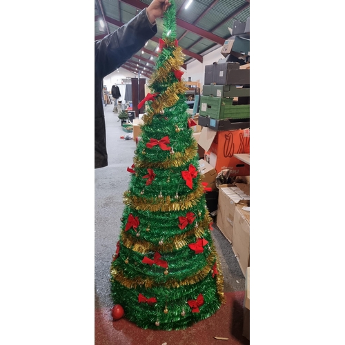 676 - Tall glittering gold and green tinsel spiral Christmas tree on a tripod base with matching gold and ... 