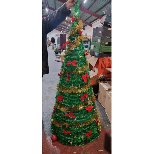 677 - Tall glittering gold and green tinsel spiral Christmas tree on a tripod base with matching gold and ... 