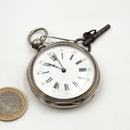 687 - A handsome antique silver eight Ruby pocket watch, with a makers mark which states 