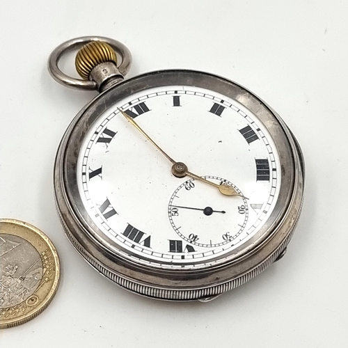 688 - A sterling silver pocket watch, with Roman numeral face and a white enamel dial. Also featured is a ... 