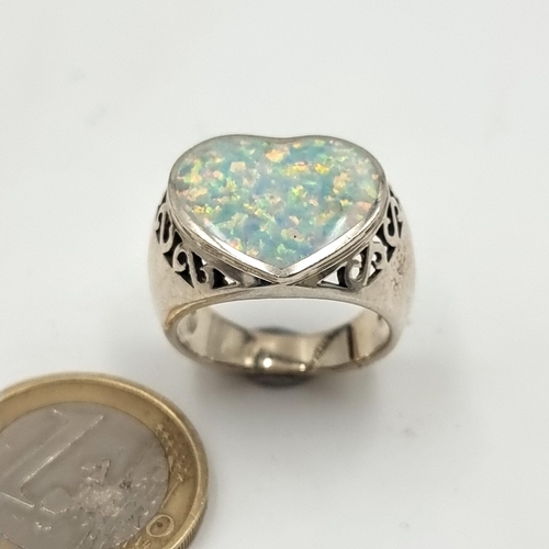 690 - A huge Opal sterling silver ring, of a pretty heart design. Ring size: Q. Weight: 8.85 grams. Fabulo... 