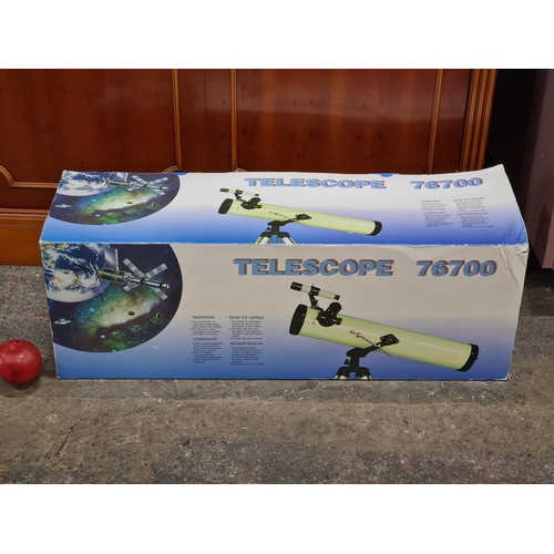 875 - An Astronomical Telescope (model 76700) with aluminium tripod in a black finish in original box. A g... 