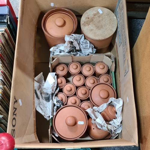 883 - A fabulous collection of 19 terracotta kitchen storage lidden jars. Each have farmhouse style labels... 