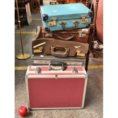 895 - A selection of five vintage travel cases and suitcases. Including some Edwardian examples and some l... 