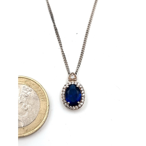 9 - A very pretty sterling Silver Sapphire pendant necklace, featuring a gem stone surround and sterling... 