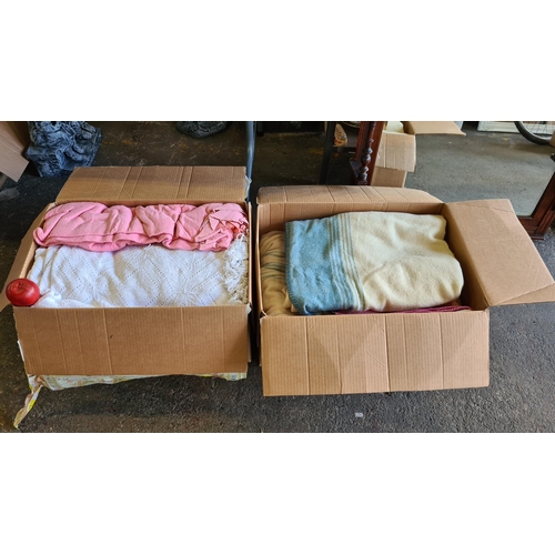 904 - Two Large  boxes filled with a nice collection of  vintage Irish blankets including knitted and wool... 