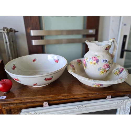 908 - Three vintage porcelain washstand items. Including a matching wash basin and pitcher jug set in a ki... 